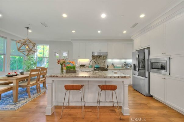 Dining room, Interior, Kitchen, Pendant Lights, Recessed Lighting, Stainless Steel Appliances, Wood Texture Flooring
