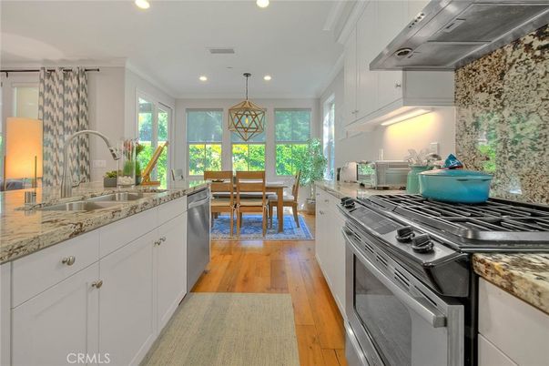 Dining room, Interior, Kitchen, Pendant Lights, Recessed Lighting, Stainless Steel Appliances, Wood Texture Flooring