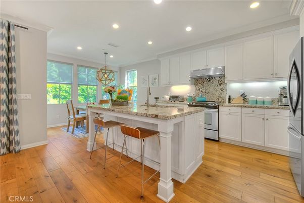 Dining room, Interior, Kitchen, Pendant Lights, Recessed Lighting, Stainless Steel Appliances, Wood Texture Flooring
