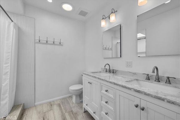 Bathroom, Dual Sink Vanities, Interior, Recessed Lighting, Wood Texture Flooring
