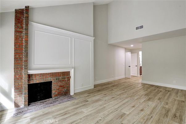 Empty room, Fireplace, Interior, Recessed Lighting, Stone Walls, Wood Texture Flooring