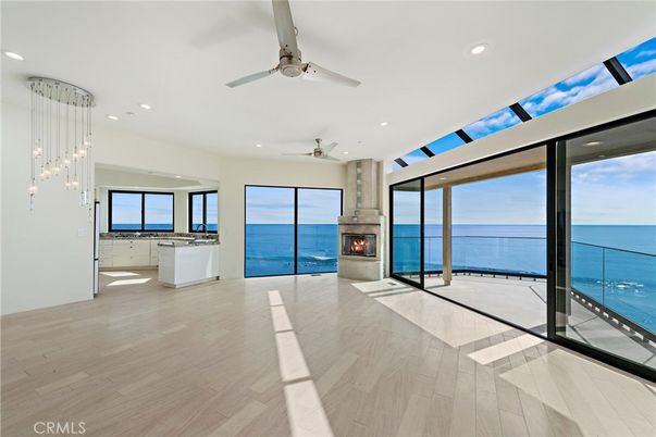 Fireplace, Glass Ceilings, Interior, Pendant Lights, Recessed Lighting, Water, Wood Texture Flooring