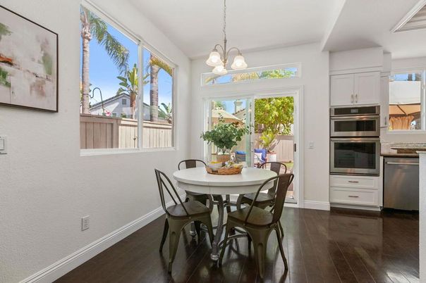 Chandelier, Dining room, Interior, Kitchen, Pendant Lights, Stainless Steel Appliances, Wood Texture Flooring