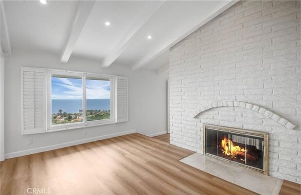 Empty room, Fireplace, Interior, Recessed Lighting, Stone Walls, Water, Wood Texture Flooring