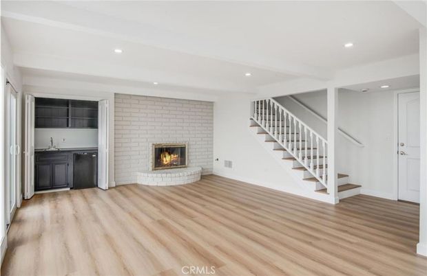 Empty room, Fireplace, Interior, Recessed Lighting, Stone Walls, Wood Texture Flooring