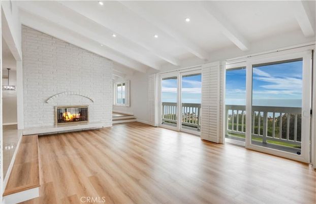 Empty room, Fireplace, Interior, Recessed Lighting, Stone Walls, Water, Wood Texture Flooring