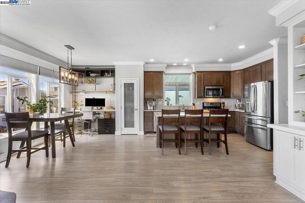 Chandelier, Dining room, Interior, Kitchen, Pendant Lights, Recessed Lighting, Stainless Steel Appliances, Wood Texture Flooring