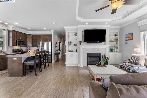 Fireplace, Interior, Kitchen, Living room, Recessed Lighting, Stainless Steel Appliances, Wood Texture Flooring