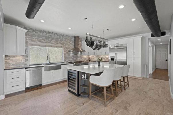 Interior, Kitchen, Pendant Lights, Recessed Lighting, Stainless Steel Appliances, Stone Walls, Wood Texture Flooring