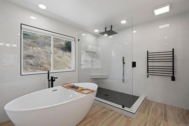 Bathroom, Free Standing Baths, Glass Shower, Interior, Marble Walls, Recessed Lighting, Wood Texture Flooring