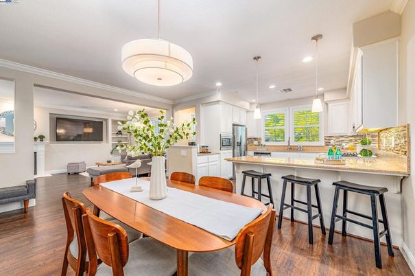 Dining room, Interior, Kitchen, Pendant Lights, Recessed Lighting, Stainless Steel Appliances, Wood Texture Flooring