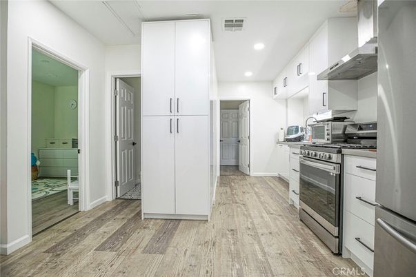Interior, Kitchen, Recessed Lighting, Stainless Steel Appliances, Wood Texture Flooring