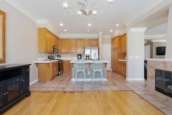 Chandelier, Fireplace, Interior, Kitchen, Recessed Lighting, Wood Texture Flooring