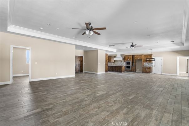 Empty room, Interior, Kitchen, Pendant Lights, Recessed Lighting, Stainless Steel Appliances, Wood Texture Flooring