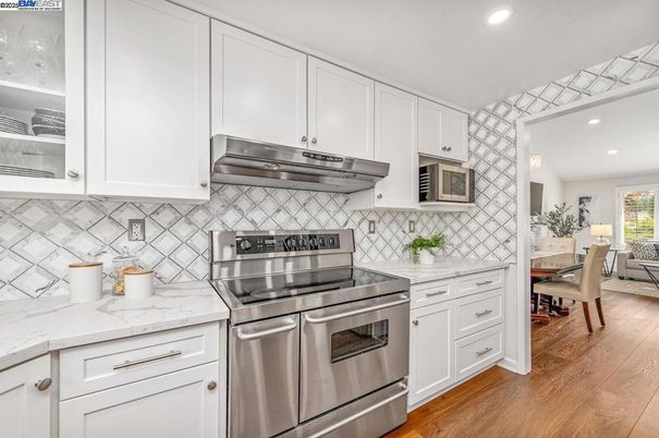 Dining room, Interior, Kitchen, Recessed Lighting, Stainless Steel Appliances, Wood Texture Flooring