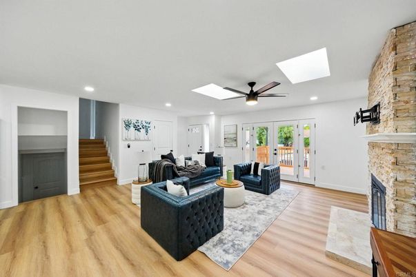 Fireplace, Interior, Living room, Recessed Lighting, Stone Walls, Wood Texture Flooring
