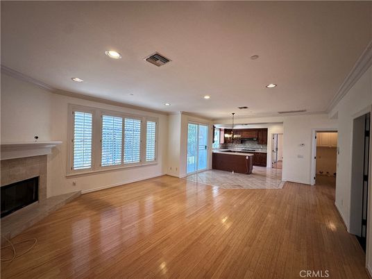 Empty room, Fireplace, Interior, Kitchen, Pendant Lights, Recessed Lighting, Wood Texture Flooring