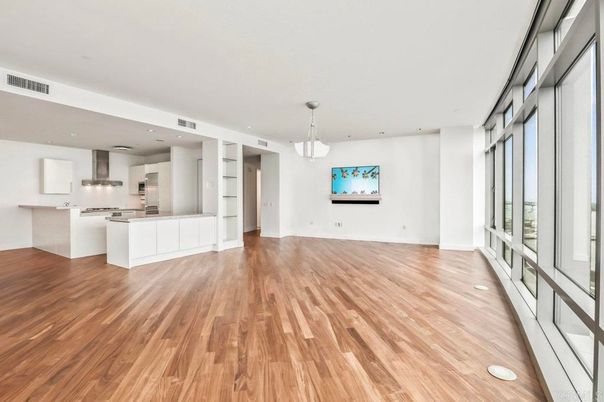 Empty room, Interior, Kitchen, Pendant Lights, Recessed Lighting, Stainless Steel Appliances, Wood Texture Flooring