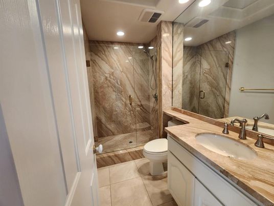 Bathroom, Glass Shower, Interior, Marble Walls, Recessed Lighting, Wood Texture Flooring