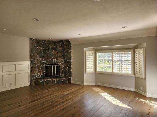 Empty room, Fireplace, Interior, Recessed Lighting, Stone Walls, Wood Texture Flooring