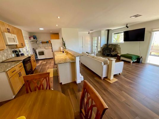 Dining room, Fireplace, Interior, Kitchen, Living room, Recessed Lighting, Wood Texture Flooring
