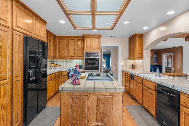 Interior, Kitchen, Recessed Lighting, Tile Countertops, Wood Texture Flooring