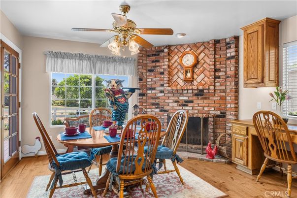 Dining room, Fireplace, Interior, Recessed Lighting, Stone Walls, Wood Texture Flooring