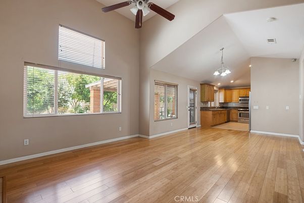 Chandelier, Empty room, Interior, Kitchen, Pendant Lights, Recessed Lighting, Stainless Steel Appliances, Wood Texture Flooring