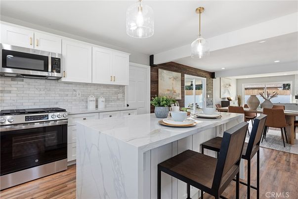 Dining room, Interior, Kitchen, Pendant Lights, Recessed Lighting, Stainless Steel Appliances, Wood Texture Flooring
