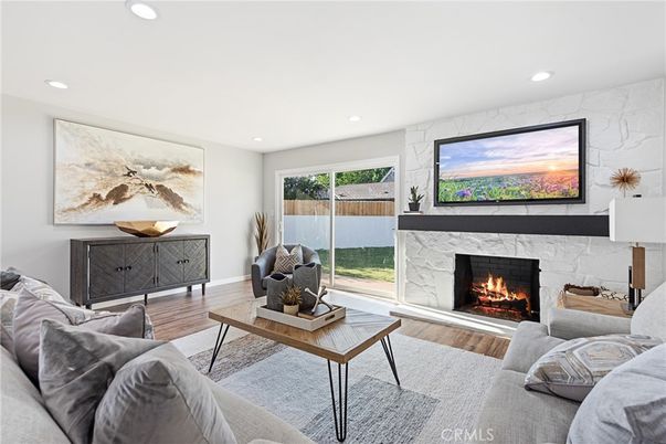 Fireplace, Interior, Living room, Marble Walls, Recessed Lighting, Wood Texture Flooring