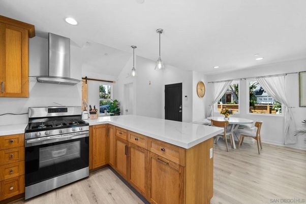 Dining room, Interior, Kitchen, Pendant Lights, Recessed Lighting, Stainless Steel Appliances, Wood Texture Flooring