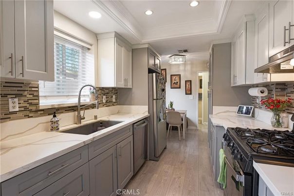Dining room, Interior, Kitchen, Recessed Lighting, Stainless Steel Appliances, Wood Texture Flooring