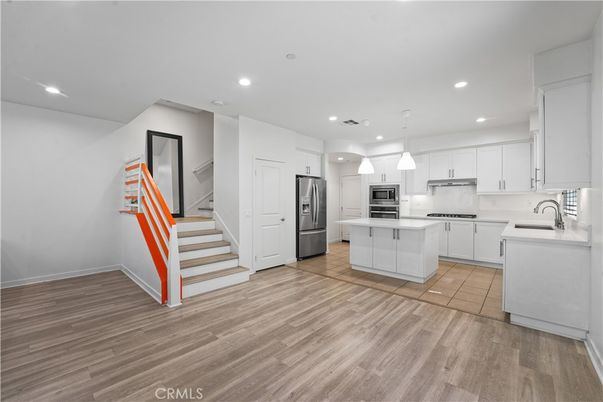 Interior, Kitchen, Pendant Lights, Recessed Lighting, Stainless Steel Appliances, Wood Texture Flooring