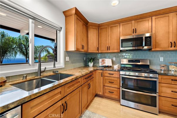 Interior, Kitchen, Recessed Lighting, Stainless Steel Appliances, Tile Countertops, Wood Texture Flooring