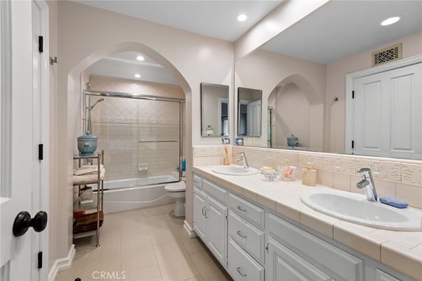 Bathroom, Dual Sink Vanities, Glass Shower, Interior, Recessed Lighting, Tile Countertops