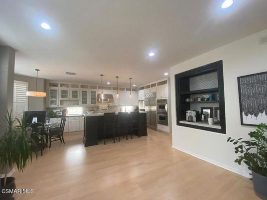 Dining room, Interior, Kitchen, Pendant Lights, Recessed Lighting, Stainless Steel Appliances, Wood Texture Flooring