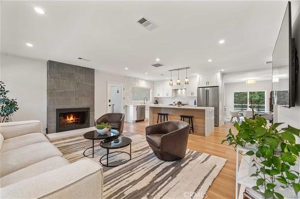 Dining room, Fireplace, Interior, Kitchen, Living room, Pendant Lights, Recessed Lighting, Stainless Steel Appliances, Wood Texture Flooring