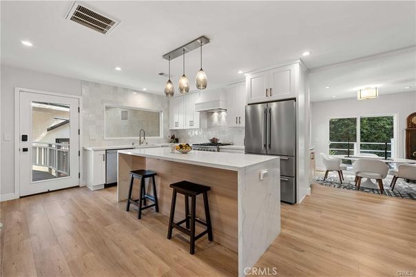 Dining room, Interior, Kitchen, Pendant Lights, Recessed Lighting, Stainless Steel Appliances, Wood Texture Flooring