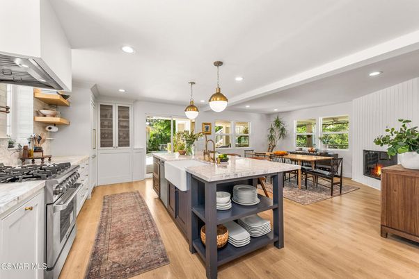 Dining room, Fireplace, Interior, Kitchen, Pendant Lights, Recessed Lighting, Stainless Steel Appliances, Wood Texture Flooring