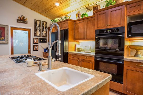 Interior, Kitchen, Recessed Lighting, Tile Countertops, Wooden Ceilings