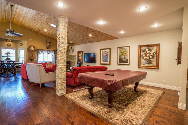 Billiard Table, Dining room, Fireplace, Game Room, Interior, Living room, Recessed Lighting, Wooden Ceilings, Wood Texture Flooring