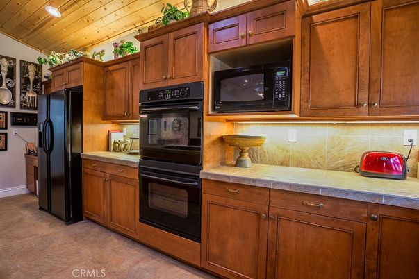 Interior, Kitchen, Recessed Lighting, Tile Countertops, Wooden Ceilings