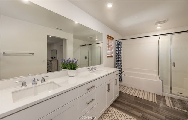 Bathroom, Dual Sink Vanities, Glass Shower, Interior, Recessed Lighting, Wood Texture Flooring