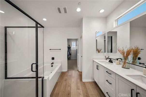 Bathroom, Dual Sink Vanities, Glass Shower, Interior, Recessed Lighting, Wood Texture Flooring
