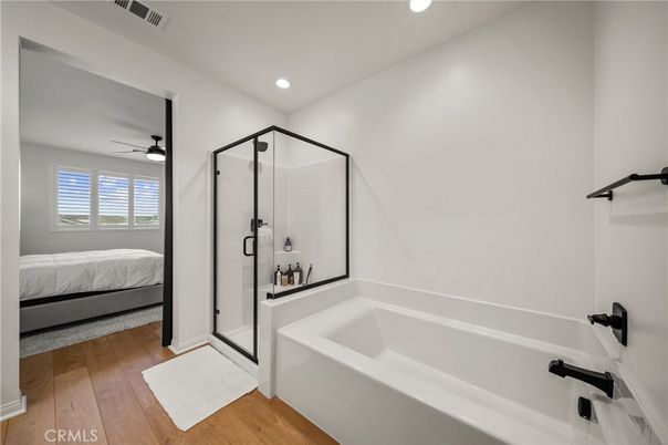 Bathroom, Bedroom, Glass Shower, Interior, Recessed Lighting, Wood Texture Flooring
