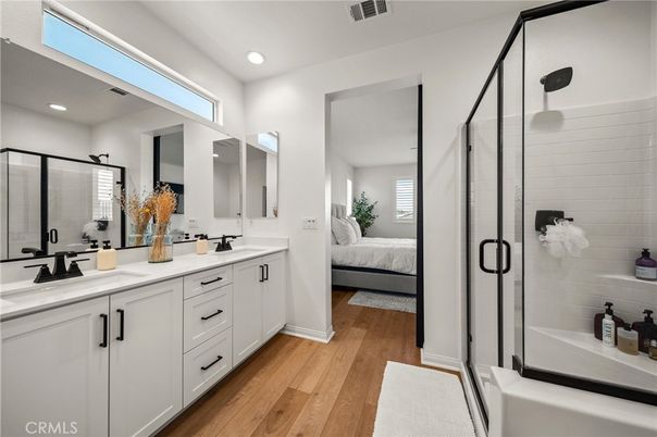 Bathroom, Bedroom, Dual Sink Vanities, Glass Shower, Interior, Recessed Lighting, Wood Texture Flooring
