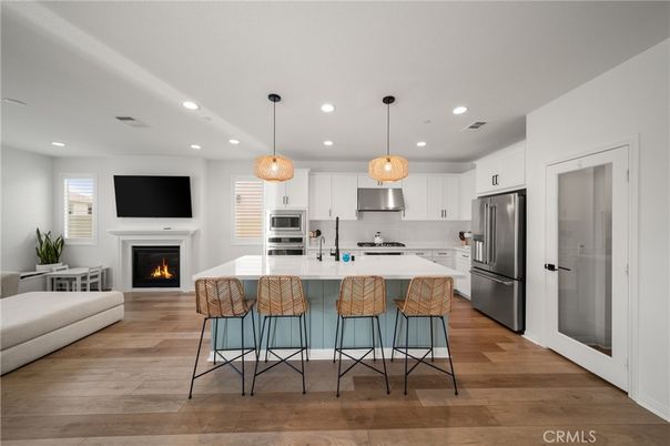 Fireplace, Interior, Kitchen, Pendant Lights, Recessed Lighting, Stainless Steel Appliances, Wood Texture Flooring