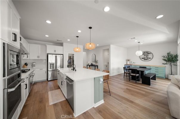 Dining room, Interior, Kitchen, Pendant Lights, Recessed Lighting, Stainless Steel Appliances, Wood Texture Flooring