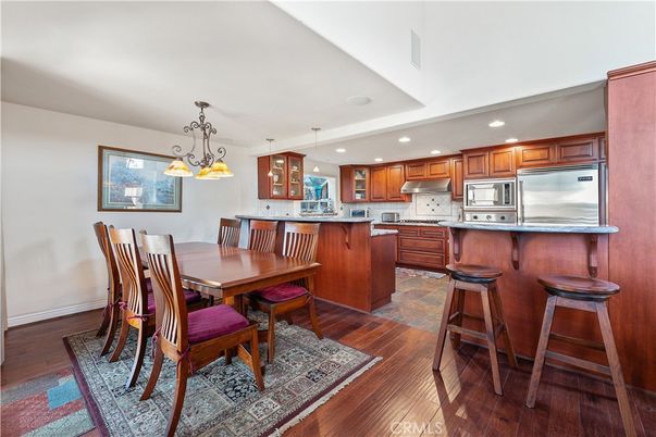 Dining room, Interior, Kitchen, Pendant Lights, Recessed Lighting, Stainless Steel Appliances, Wood Texture Flooring