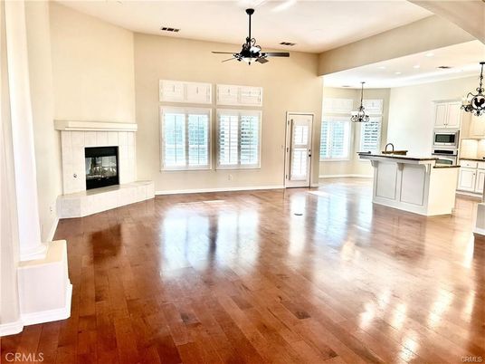Empty room, Fireplace, Interior, Kitchen, Pendant Lights, Recessed Lighting, Wood Texture Flooring